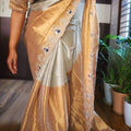 Fancy Banarasi tissue saree in silver and gold with Aari and beads work – Arhas Couture